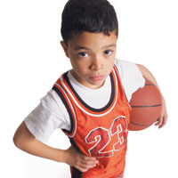 Boy in jersey holding basketball
