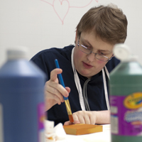 Boy practicing art therapy