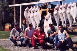 Alaskan campers in 2004 proudly display their catch of halibut.