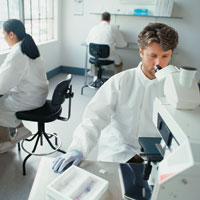 Scientists in lab analyzing blood samples