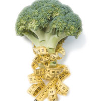 Raw broccoli wrapped with yellow tape measure