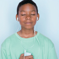 Boy with ear buds listening to music