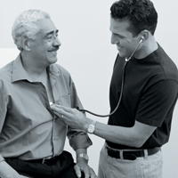 Older man being examined by doctor