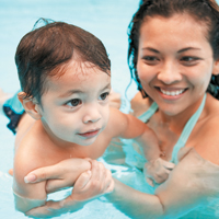 Mother and son in swimming pool