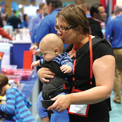 Woman kissing top of baby's head