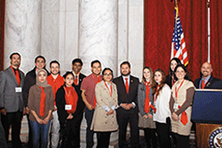 Group of people standing with Representative Ruben Gallego