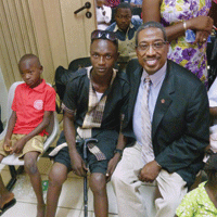NHF CEO Val D. Bias poses with bleeding disorder patients at the National Hospital in Abuja, Nigeria