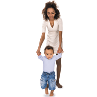 Woman in white dress holding arms of toddler dressed in blue