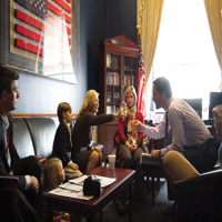 Jennifer Banks shows clotting factor product to Rep. Jim Himes