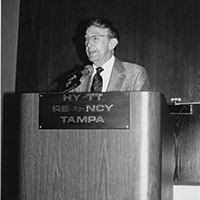Harold Roberts, MD speaking at podium
