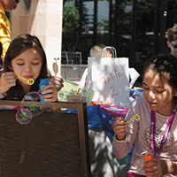 Kids at the Denver Summit Youth Camp blowing bubbles