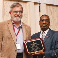 Val Bias presenting award to David Cavenaugh