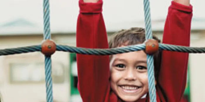 Boy with hemophilia on playground
