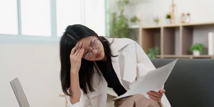 Person rubbing forehead