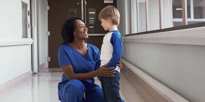 HTC nurse comforts young boy