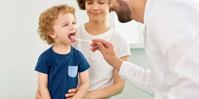 boy being examined by doctor