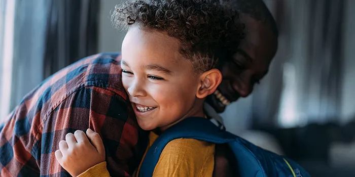 Boy with his father on the first day of school