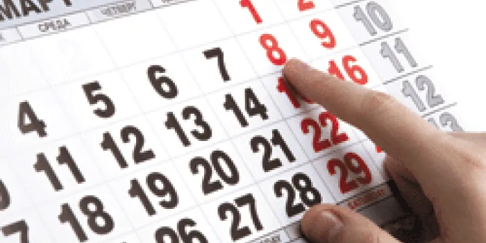 Finger pointing at March 14, 2014 on calendar