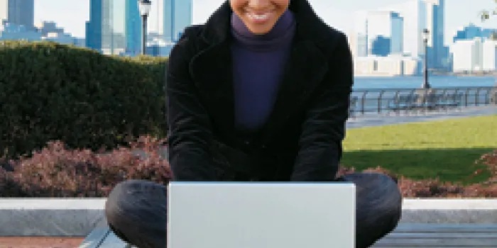 Woman with bleeding disorder on a laptop