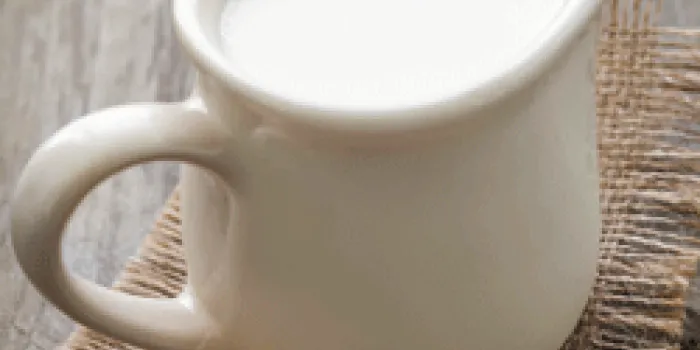 Small white pitcher of milk