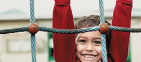 Boy with hemophilia on playground