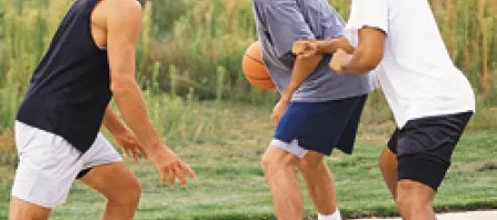 Wearing proper shoes while playing basketball