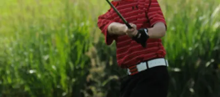 Ben Gruher chips in during Oregon Junior Golf tournament.