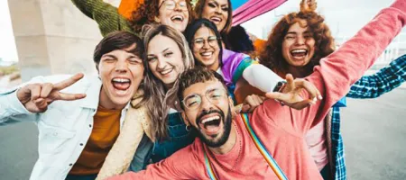 A group of excited people celebrating in a photograph together