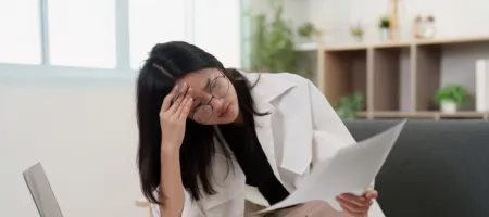 Person rubbing forehead