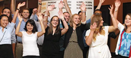 NYLI participants celebrating, hands in air at NHF's 2015 Annual Meeting
