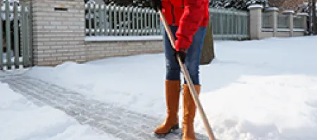 Woman shoveling snow 