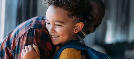 Boy with his father on the first day of school