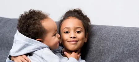 two children hugging