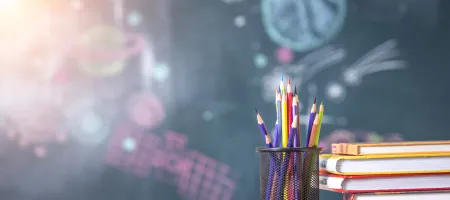 Pencils, books, chalkboard 