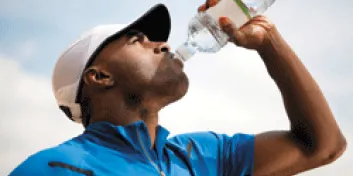 Man drinking from bottle of water