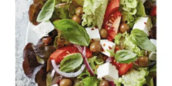 Salad with lettuce, tomatoes, olives and cheese