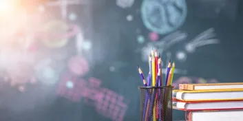 Pencils, books, chalkboard 