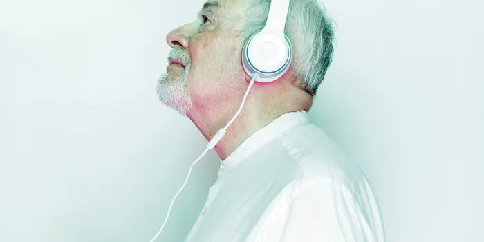 Older man wearing headphones